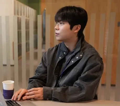 Youngtak Jo pitching, seated at a laptop